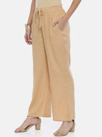 Souchii Beige Solid Flared Palazzos | Grocsy