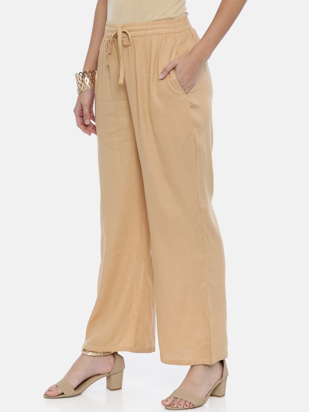 Souchii Beige Solid Flared Palazzos | Grocsy