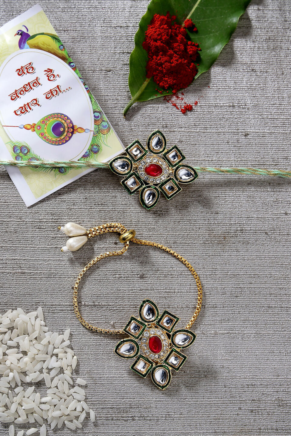NVR Women & Men Set of 2 Gold Kundan-Studded Handcrafted Wraparound Rakhi Set With Roli Chawal | Grocsy
