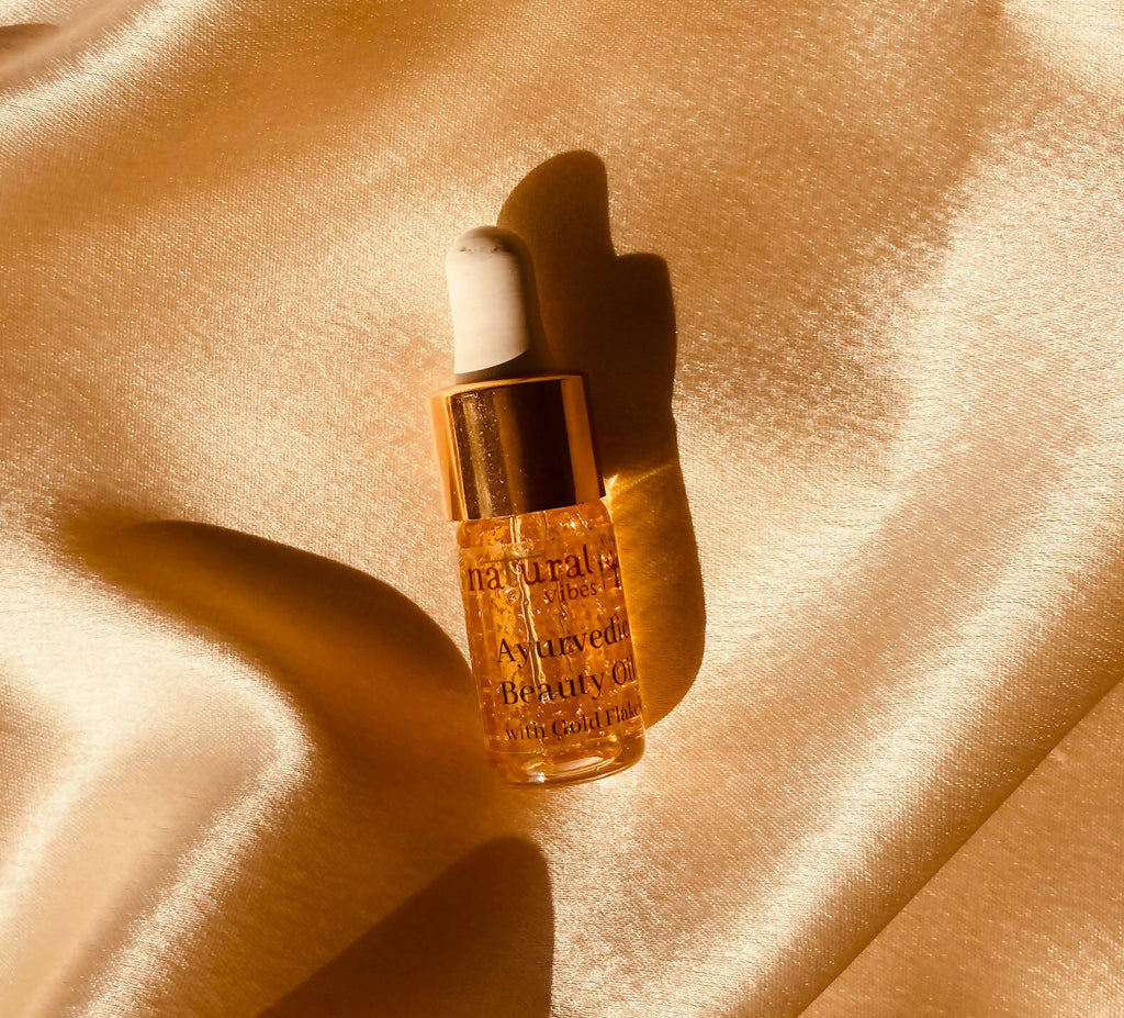 Natural Vibes Ayurvedic Gold Beauty Oil with Gold Flakes | Grocsy