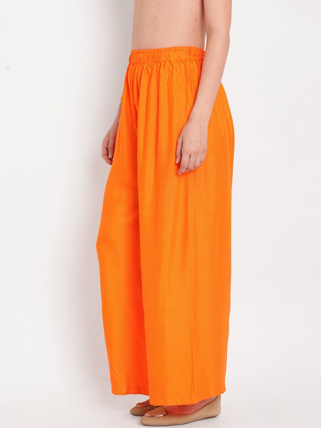 TAG 7 Women Orange Solid Flared Palazzos | Grocsy