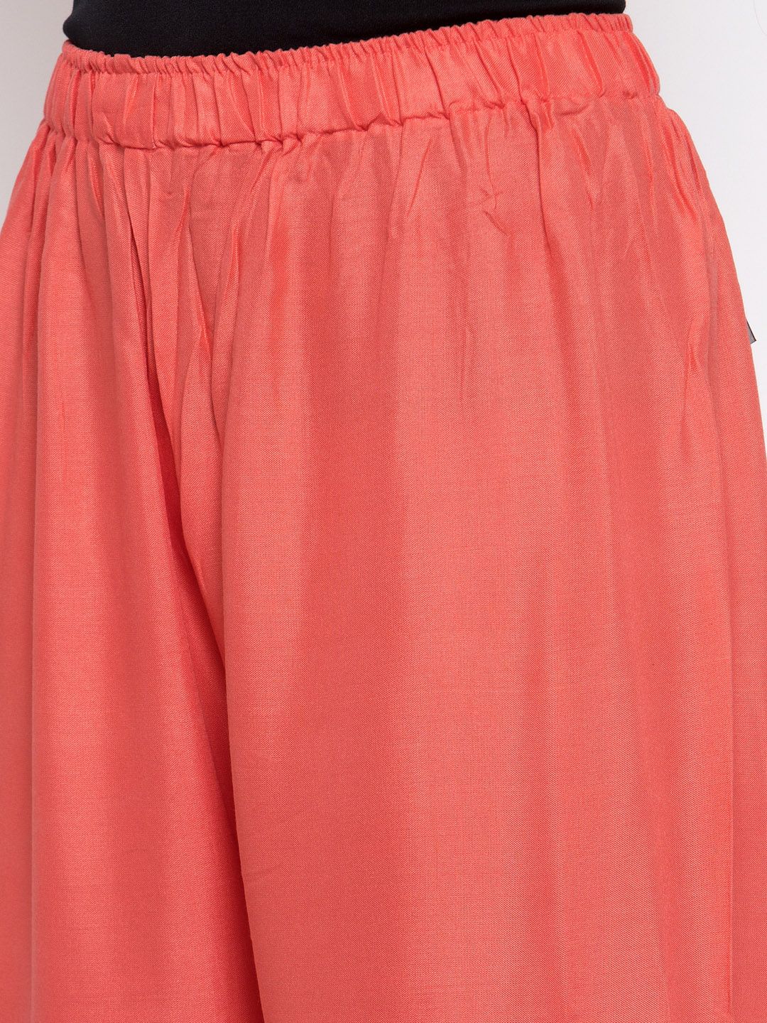 TAG 7 Women Peach-Coloured Solid Flared Palazzos | Grocsy