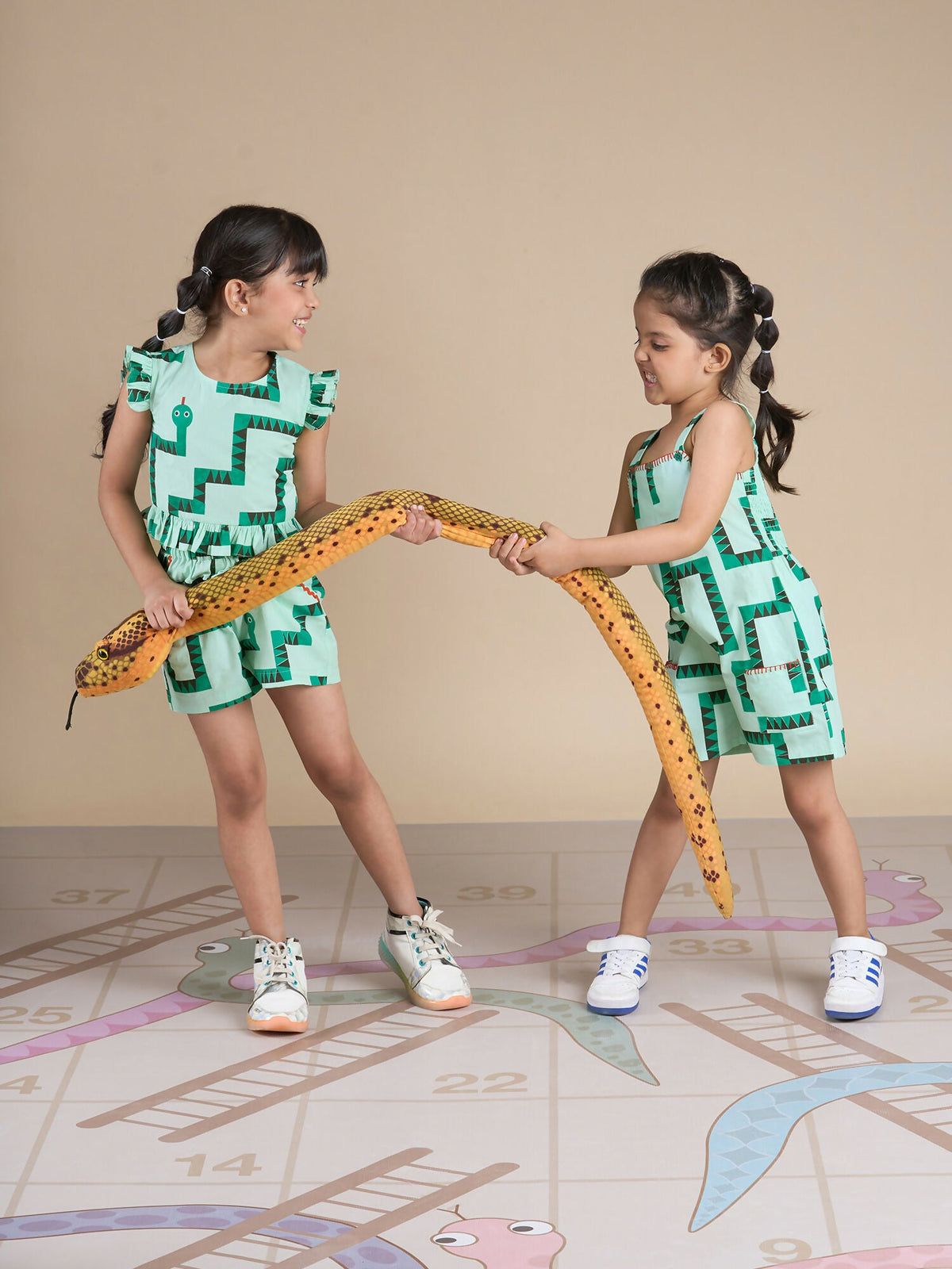 Snakes and Ladders Girls Green Table Print Jumpsuit from Siblings Collection | Grocsy