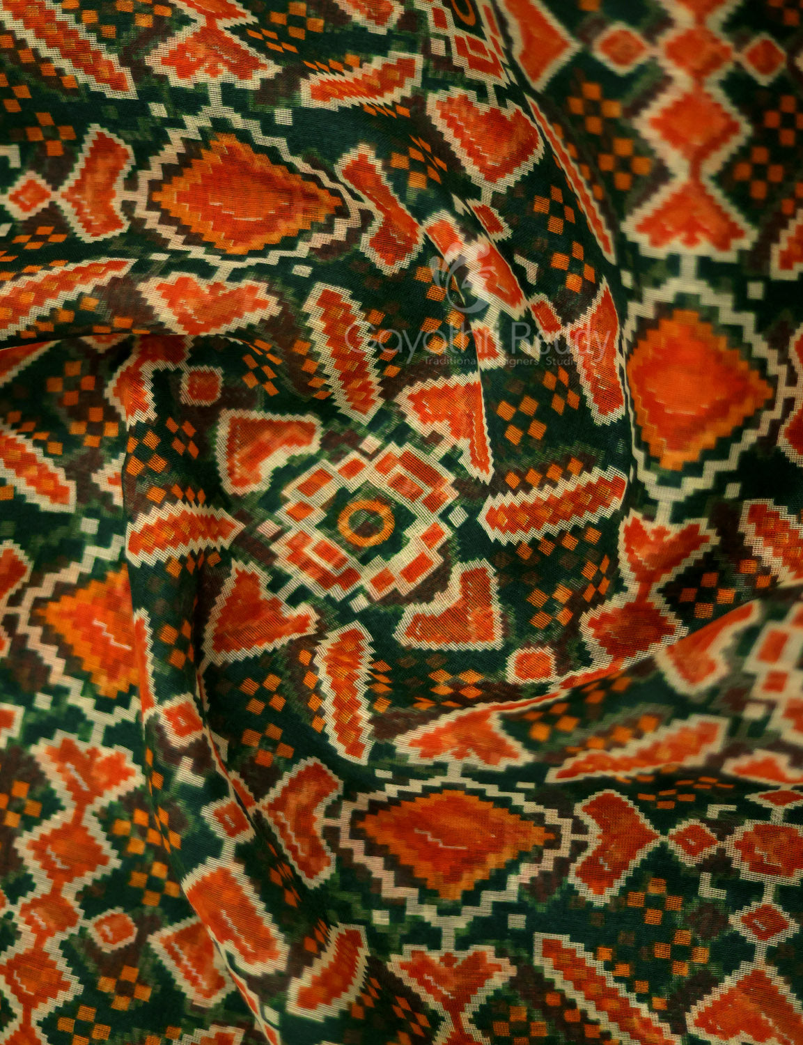 Shades of Dark Green And Orange Colour Patola Print Semi Chanderi Saree By Gayathri Reddy Designer Studio | Grocsy