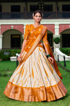 Lorenvalley Cream and Mustard Dola Silk Shibori Print With Zari Weaving Border Lehenga Choli | Grocsy
