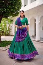 Evanik Green Tassa Silk With Bandhej Print Lehenga Choli | Grocsy