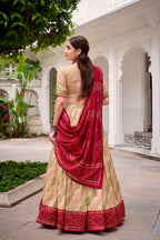 Evanik Offwhite Tassa Silk With Bandhej Print Lehenga Choli | Grocsy
