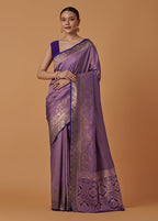 Monjolika Fashion Lavender Banarasi Silk Blend SareeWith Traditional & Modern Dulha Dulhan Figure Zari Woven Detailing | Grocsy