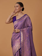 Monjolika Fashion Lavender Banarasi Silk Blend SareeWith Traditional & Modern Dulha Dulhan Figure Zari Woven Detailing | Grocsy