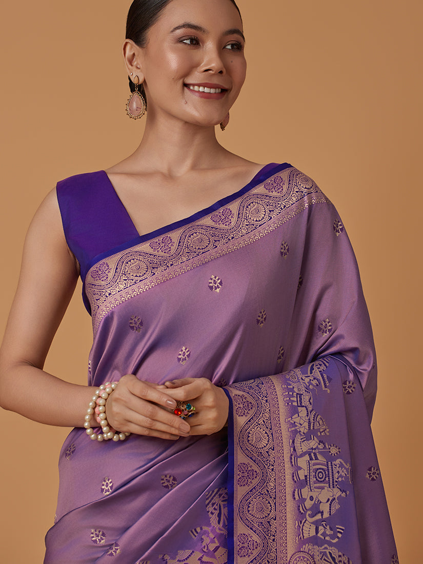 Monjolika Fashion Lavender Banarasi Silk Blend SareeWith Traditional & Modern Dulha Dulhan Figure Zari Woven Detailing | Grocsy