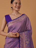Monjolika Fashion Lavender Banarasi Silk Blend SareeWith Traditional & Modern Dulha Dulhan Figure Zari Woven Detailing | Grocsy
