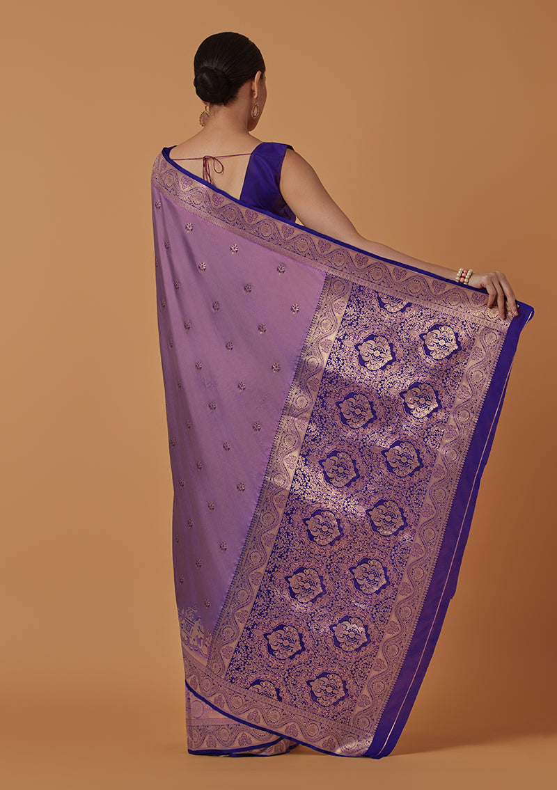 Monjolika Fashion Lavender Banarasi Silk Blend SareeWith Traditional & Modern Dulha Dulhan Figure Zari Woven Detailing | Grocsy