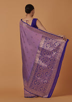 Monjolika Fashion Lavender Banarasi Silk Blend SareeWith Traditional & Modern Dulha Dulhan Figure Zari Woven Detailing | Grocsy