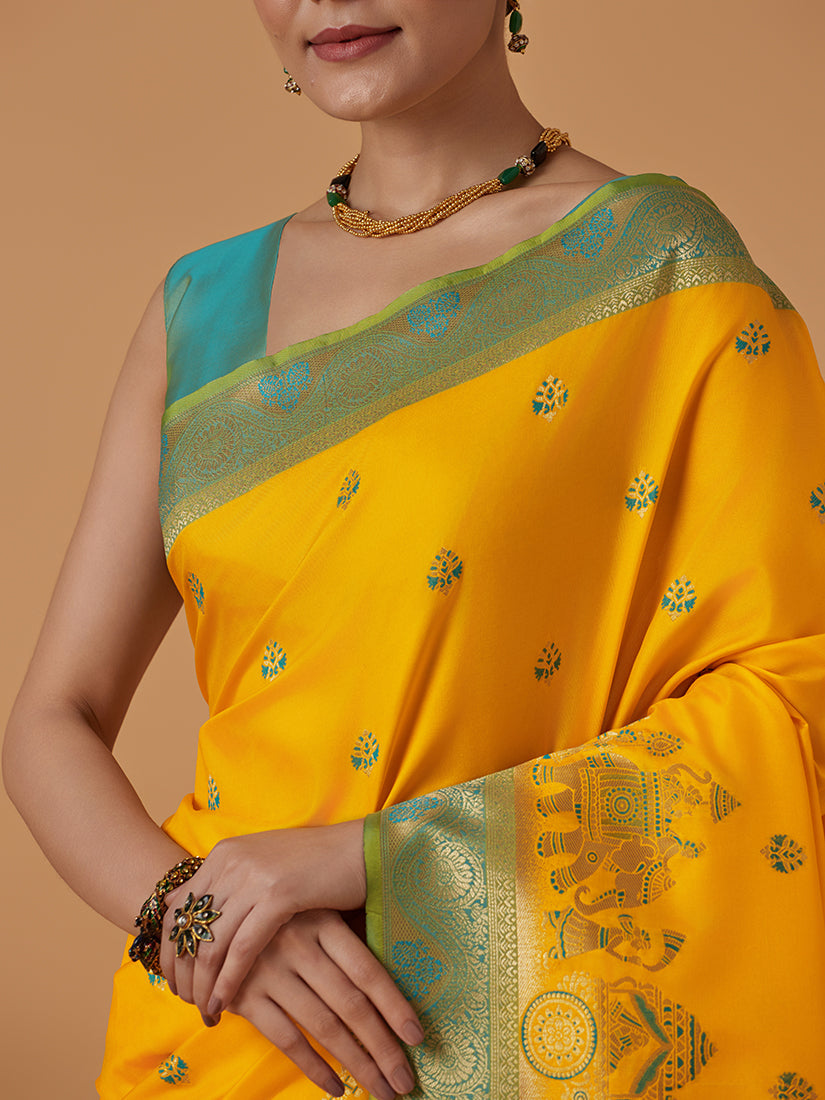 Monjolika Fashion Yellow Banarasi Silk Blend SareeWith Traditional & Modern Dulha Dulhan Figure Zari Woven Detailing | Grocsy