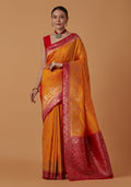 Monjolika Fashion Amber Banarasi Silk Blend SareeWith Traditional & Modern Dulha Dulhan Figure Zari Woven Detailing | Grocsy