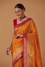 Monjolika Fashion Amber Banarasi Silk Blend SareeWith Traditional & Modern Dulha Dulhan Figure Zari Woven Detailing | Grocsy