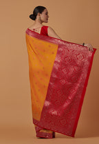 Monjolika Fashion Amber Banarasi Silk Blend SareeWith Traditional & Modern Dulha Dulhan Figure Zari Woven Detailing | Grocsy