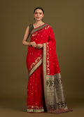 Monjolika Fashion Red Banarasi Silk Blend SareeIn Classic Paisley & Rich Zari Pallu Comes With Unstitched Blouse | Grocsy