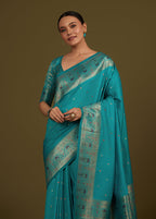Monjolika Fashion Elegant Cyan Banarasi Silk Blend SareeBrocade Motifs & Zari Woven Splendor | Grocsy