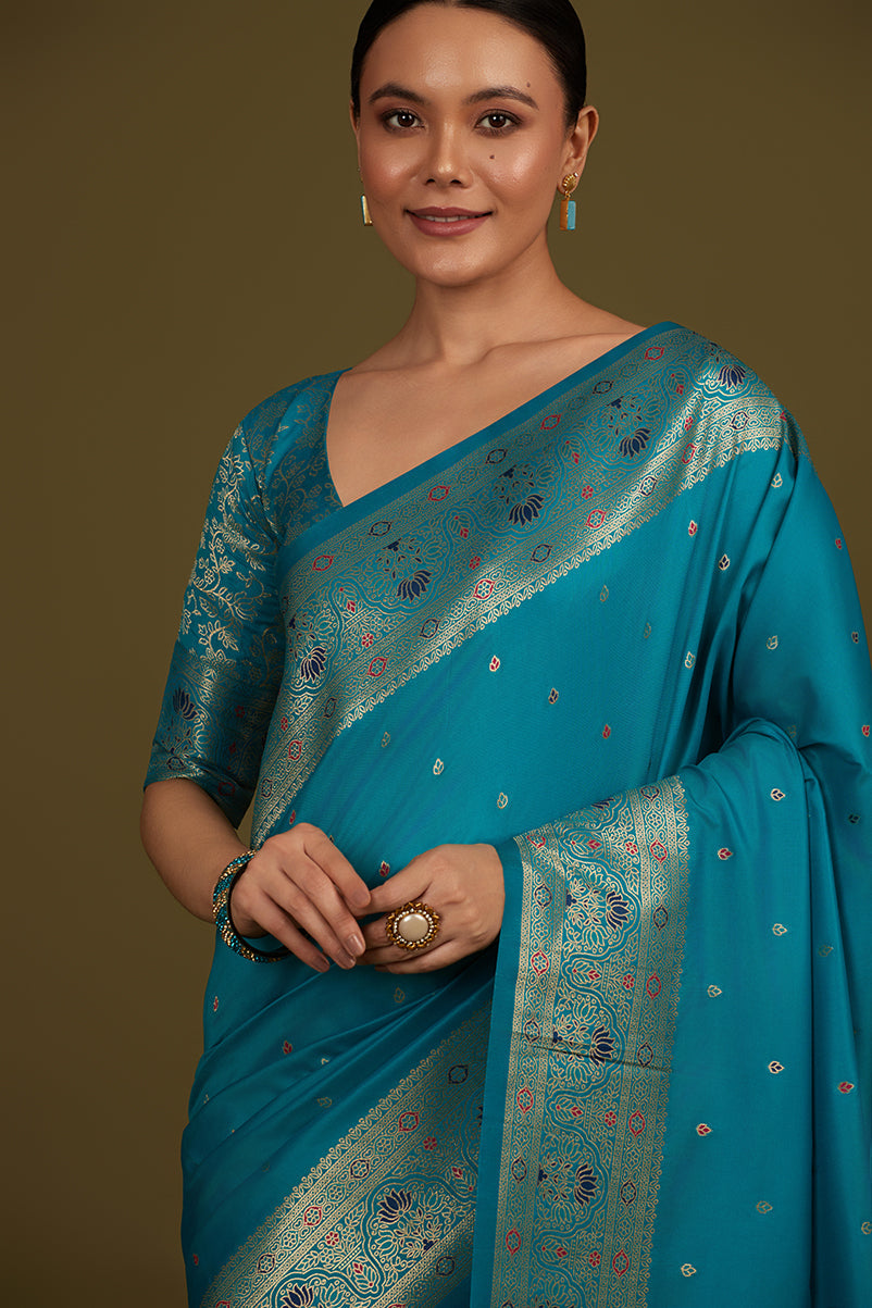 Monjolika Fashion Elegant Cyan Banarasi Silk Blend SareeBrocade Motifs & Zari Woven Splendor | Grocsy