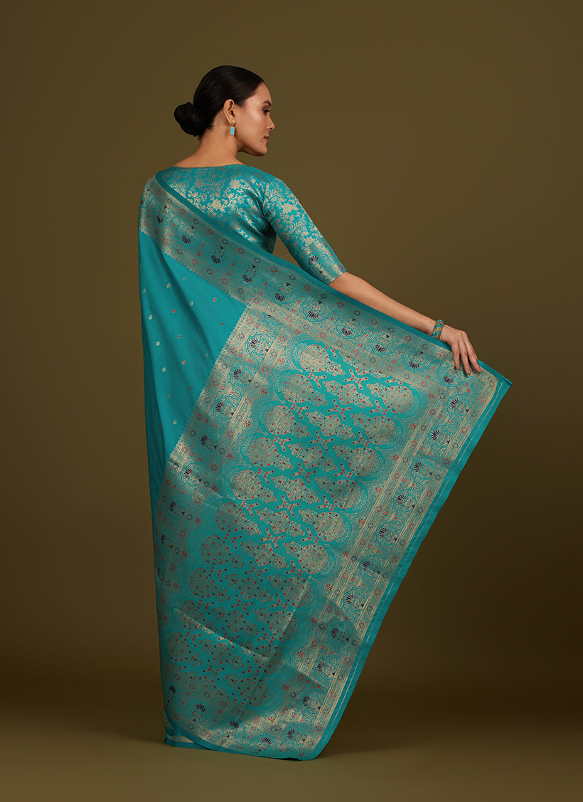 Monjolika Fashion Elegant Cyan Banarasi Silk Blend SareeBrocade Motifs & Zari Woven Splendor | Grocsy