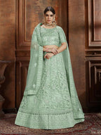 Myra Pista Green Soft Net Heavy Embroidered Lehenga | Grocsy