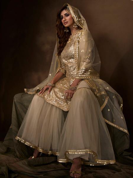 Myra Dusky Beige Soft Net Gharara Suit | Grocsy