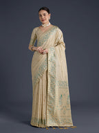 Monjolika Fashion Cream Banarasi Satin Silk Saree With Zari Border And Butti Work | Grocsy