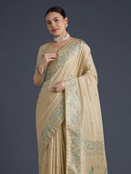 Monjolika Fashion Cream Banarasi Satin Silk Saree With Zari Border And Butti Work | Grocsy