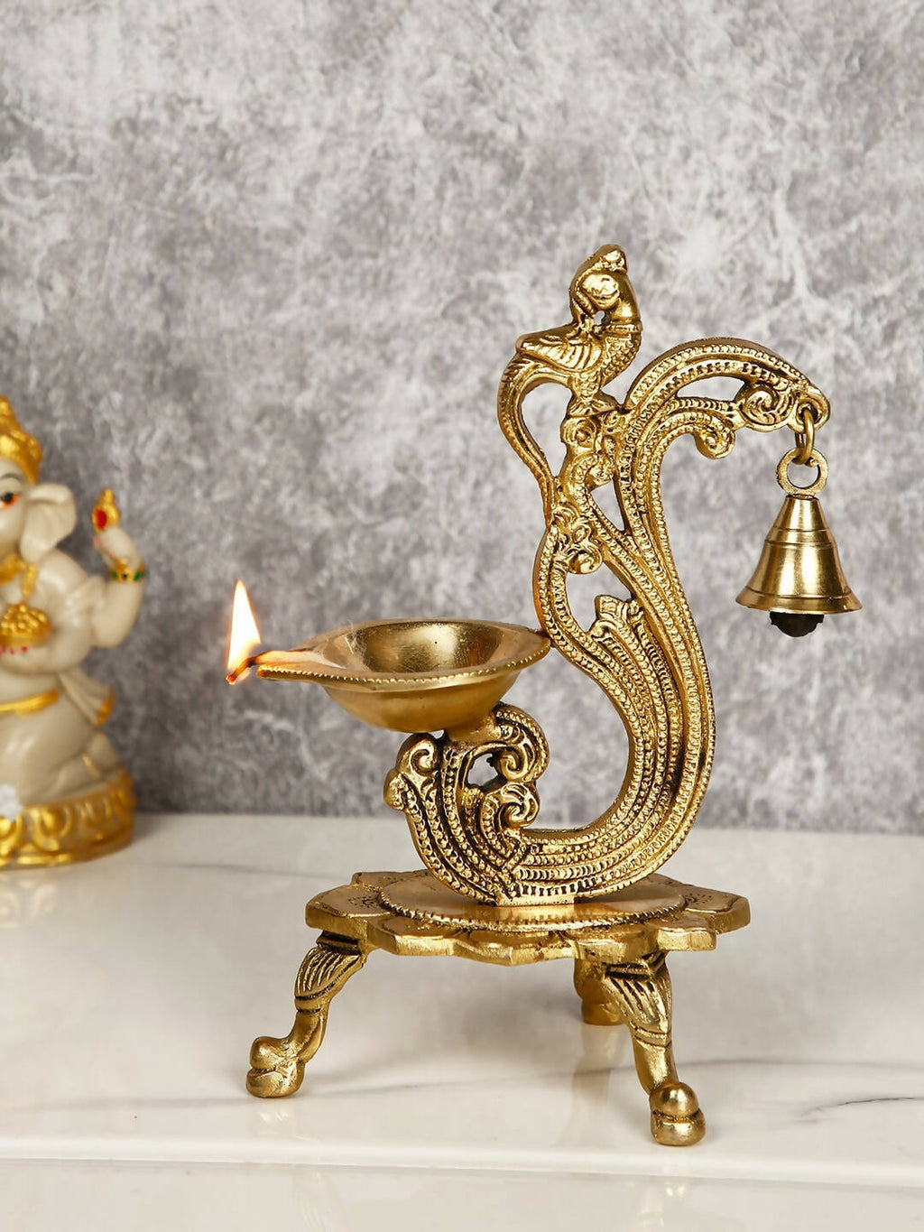 CraftVatika Gold-Toned Brass Handmade Decorative Peacock Design Diya with Bell & Stand | Grocsy