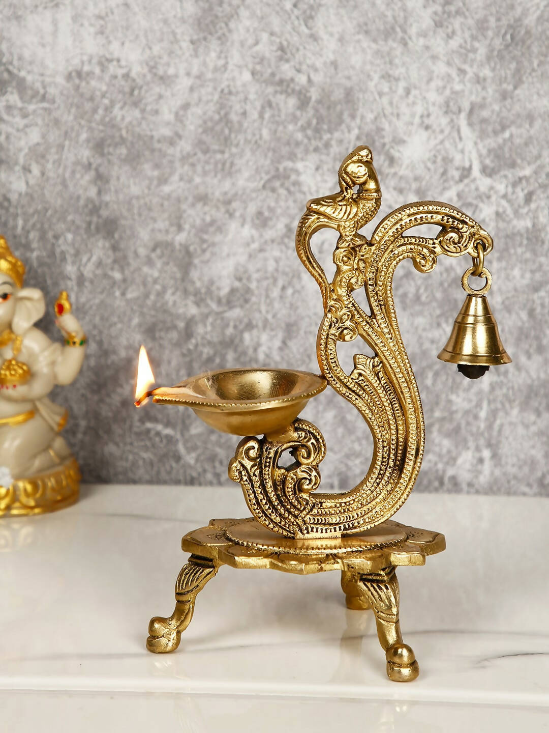 CraftVatika Gold-Toned Brass Handmade Decorative Peacock Design Diya with Bell & Stand | Grocsy