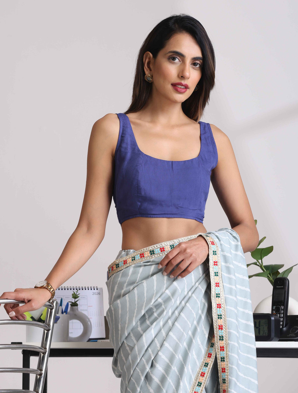 trueBrowns Blue Muslin Solid Sleeveless Blouse | Grocsy