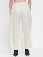 TAG 7 Women Off-White Solid Flared Palazzos | Grocsy
