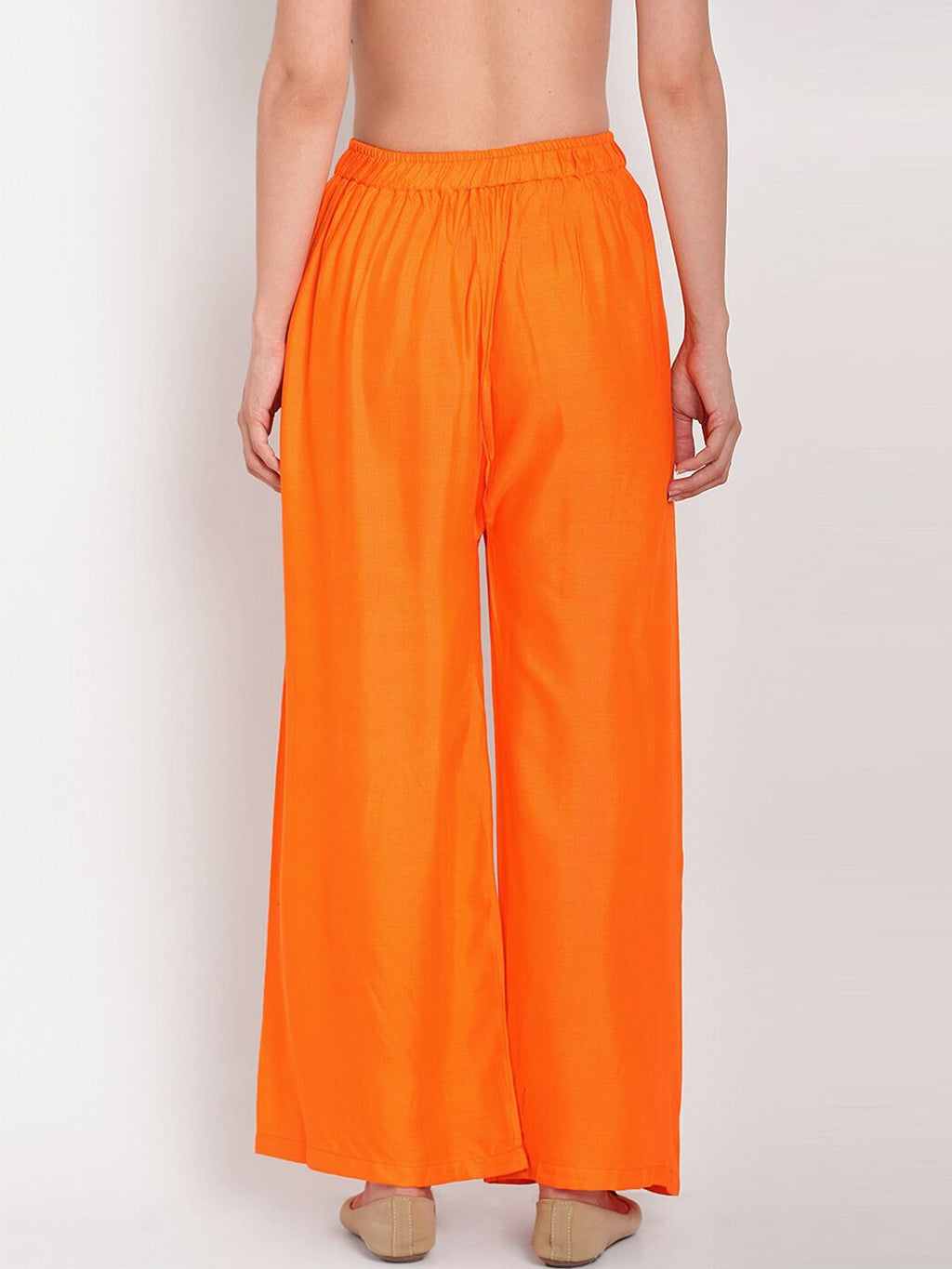 TAG 7 Women Orange Solid Flared Palazzos | Grocsy
