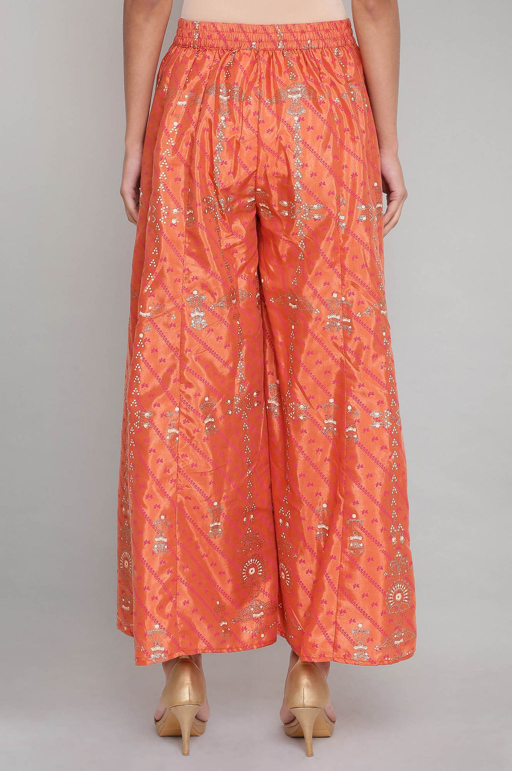 W for Woman Orange Printed Flared Pants | Grocsy