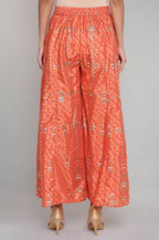 W for Woman Orange Printed Flared Pants | Grocsy