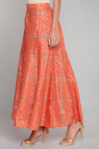 W for Woman Orange Printed Flared Pants | Grocsy