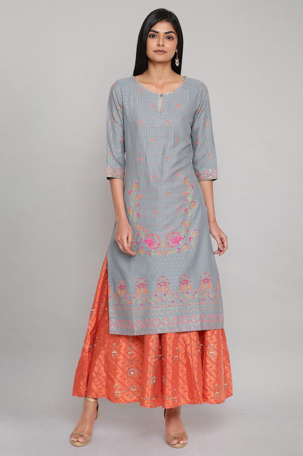 W for Woman Orange Printed Flared Pants | Grocsy