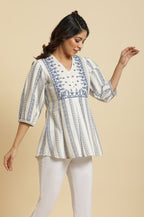 W for Woman Ecru Peplum Top In Blue Print | Grocsy