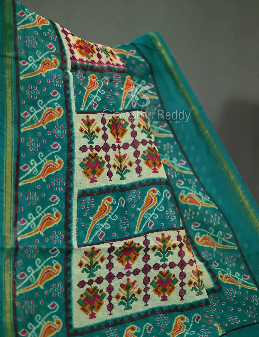 Vibrant Shades of Cream Patola Print Semi Chanderi Saree By Gayathri Reddy Designer Studio | Grocsy