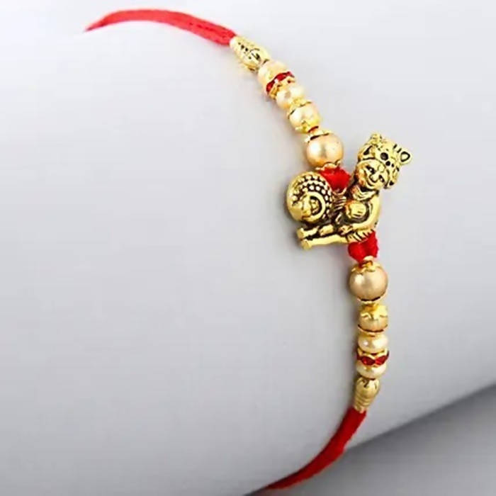Divine Lord Krishna Pearl Rakhi & Kaju Roll Box | Grocsy