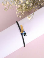 NVR Women & Men Black Evil Eye Spring Ring Rakhi With Roli Chawal | Grocsy