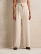 trueBrowns Ivory Woollen Flared Pants | Grocsy