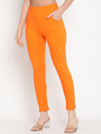TAG 7 Women Orange Solid Leggings | Grocsy