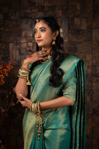 Vardha Turquoise Blue Golden Zari Brocade Kanjeevaram Silk Saree | Grocsy