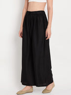 TAG 7 Women Black Solid Flared Palazzos | Grocsy