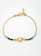 NVR Women Gold-Polished & Black Brass Stone-Studded Hand Mangalsutra Link Bracelet | Grocsy