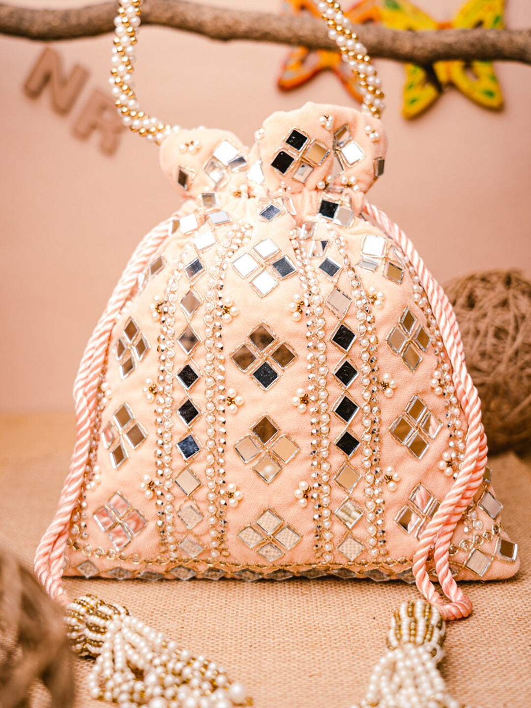 NR By Nidhi Rathi Peach-Coloured & White Embroidered Potli Clutch | Grocsy