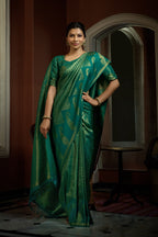 Vardha Teal Green Golden Zari Kanjeevaram Silk Saree | Grocsy