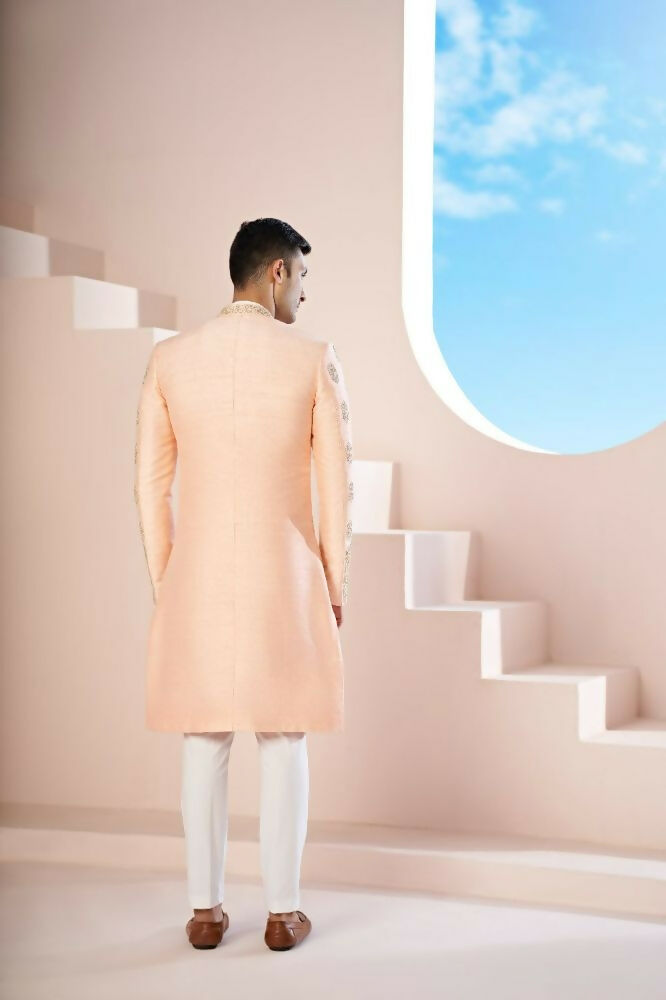 The Peach Sherwani Features Hexagonal Butas , V-Shaped Floral Jal Borders by Hilo Design | Grocsy